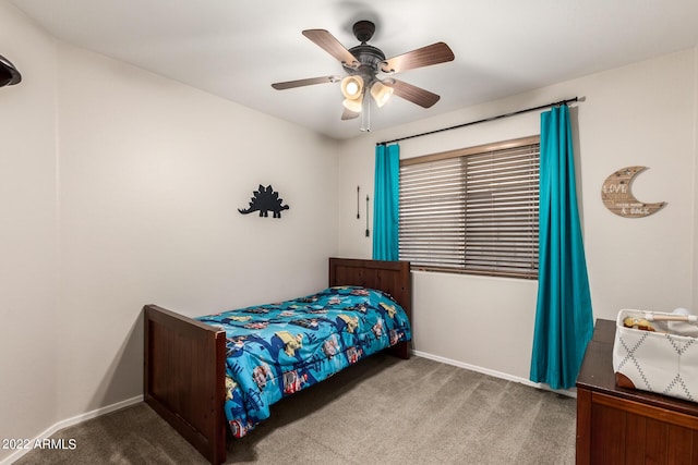 bedroom featuring ceiling fan and carpet