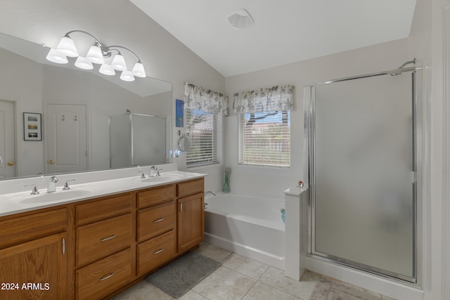 bathroom featuring tile patterned flooring, vanity, vaulted ceiling, and plus walk in shower