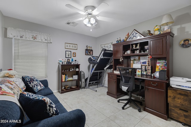 tiled home office featuring ceiling fan