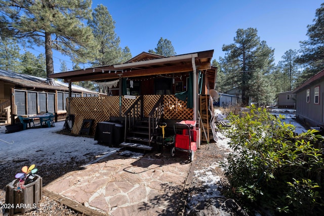 rear view of property with a patio area