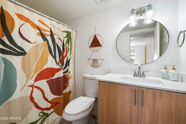 3737 E Turney Ave Unit 206, Phoenix, AZ 85018 - bathroom with vanity, toilet, and curtained shower