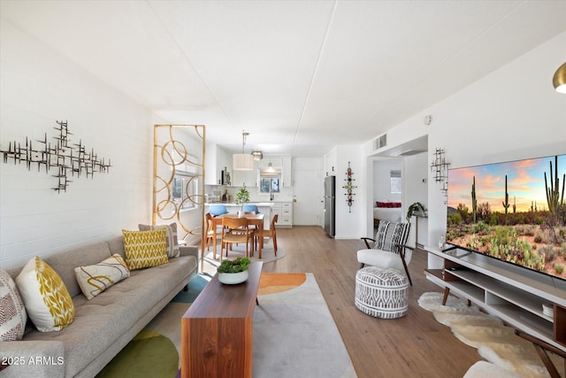 3737 E Turney Ave Unit 206, Phoenix, AZ 85018 - living room featuring light wood finished floors