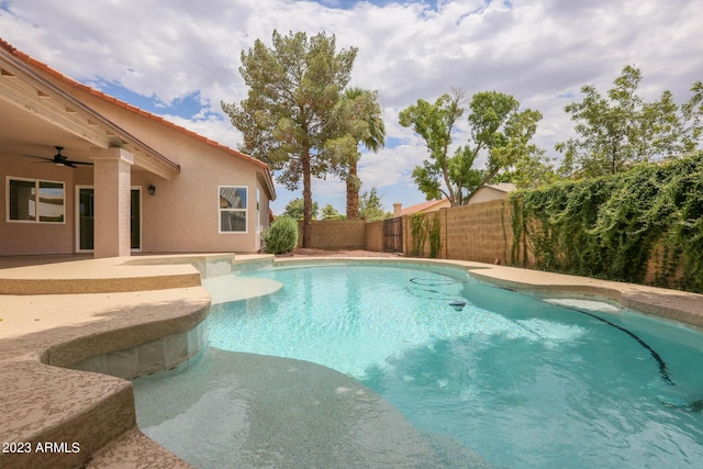 view of swimming pool featuring a fenced backyard, a patio, a fenced in pool, and ceiling fan