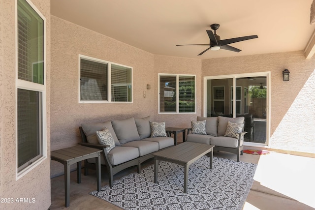 view of patio / terrace with an outdoor living space and ceiling fan