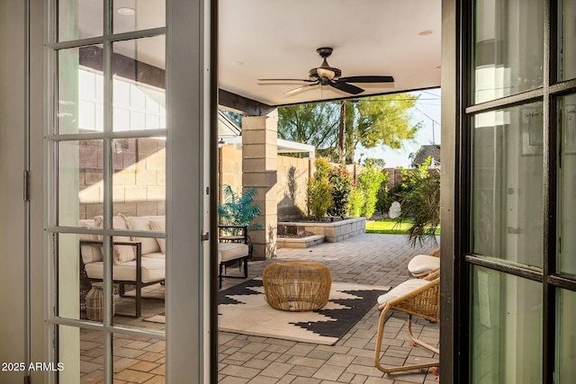 exterior space with ceiling fan