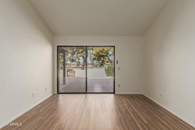 unfurnished room featuring wood-type flooring