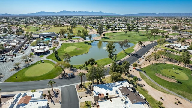 birds eye view of property featuring golf course view and a water and mountain view