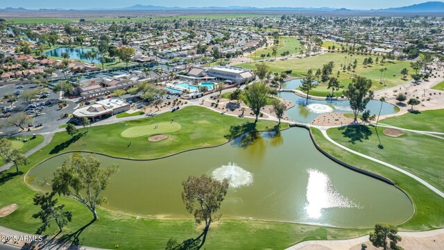 bird's eye view with a water and mountain view and view of golf course