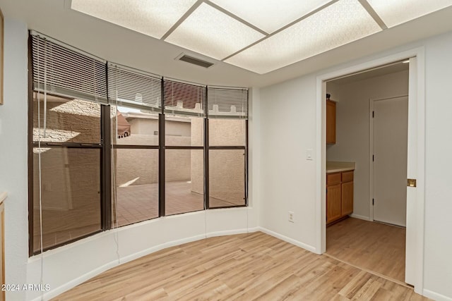 unfurnished room featuring light hardwood / wood-style floors