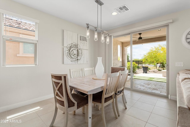 21090 N 267th Dr, Buckeye, AZ 85396 - dining space with light tile patterned floors, visible vents, and a wealth of natural light