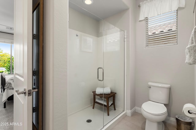 21090 N 267th Dr, Buckeye, AZ 85396 - full bath featuring baseboards, tile patterned floors, toilet, and a shower stall