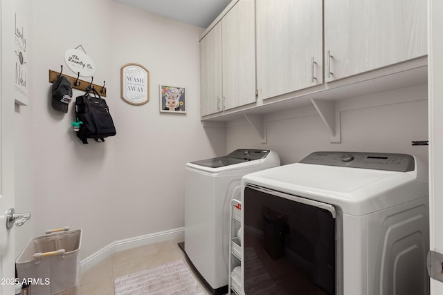 21090 N 267th Dr, Buckeye, AZ 85396 - washroom featuring cabinet space, light tile patterned flooring, baseboards, and washing machine and dryer