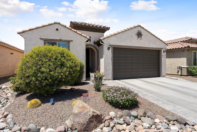 21090 N 267th Dr, Buckeye, AZ 85396 - mediterranean / spanish-style house with a garage, stucco siding, driveway, and a tile roof