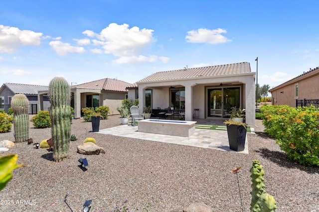 21090 N 267th Dr, Buckeye, AZ 85396 - rear view of property with a ceiling fan, a tile roof, a patio area, and stucco siding