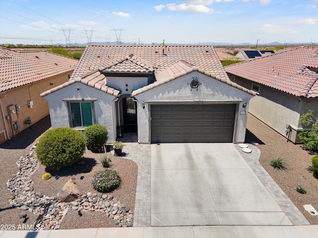 21090 N 267th Dr, Buckeye, AZ 85396 - mediterranean / spanish-style house with a garage, stucco siding, a tiled roof, and concrete driveway