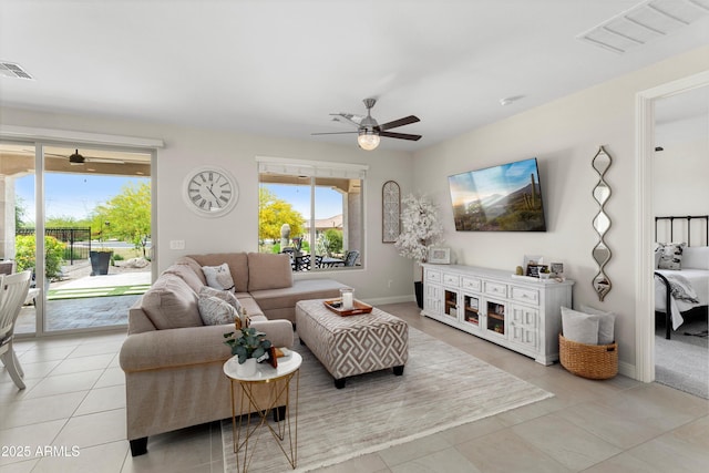 21090 N 267th Dr, Buckeye, AZ 85396 - living area with plenty of natural light, a ceiling fan, and visible vents