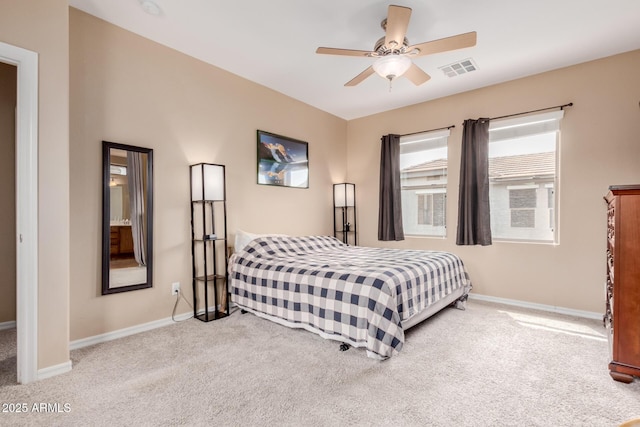 carpeted bedroom with baseboards, ceiling fan, and visible vents