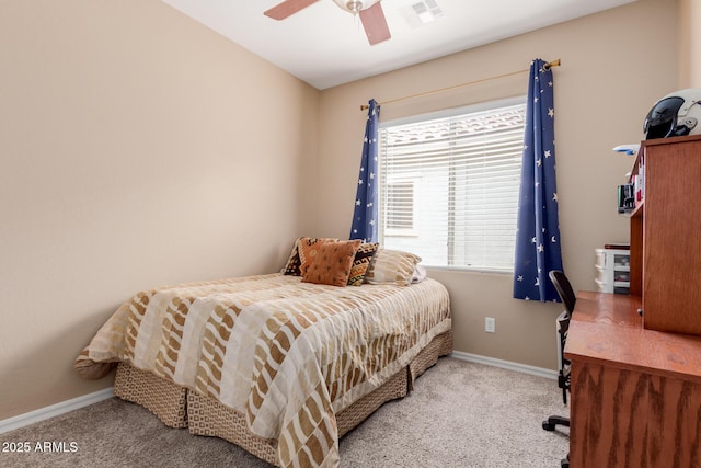 carpeted bedroom featuring baseboards, ceiling fan, and visible vents