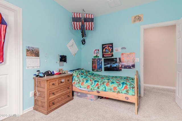 carpeted bedroom with baseboards and visible vents