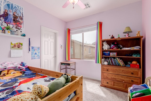 carpeted bedroom featuring baseboards, visible vents, and ceiling fan