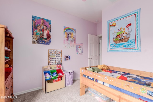 bedroom featuring baseboards and carpet