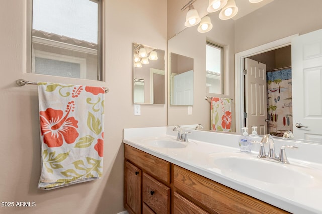 bathroom featuring double vanity and a sink