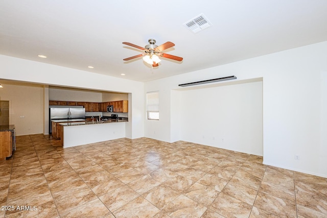 unfurnished living room featuring visible vents, recessed lighting, and a ceiling fan