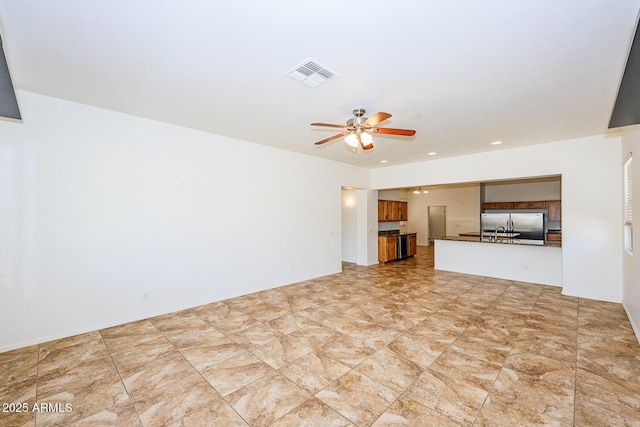 unfurnished living room with a ceiling fan, recessed lighting, and visible vents