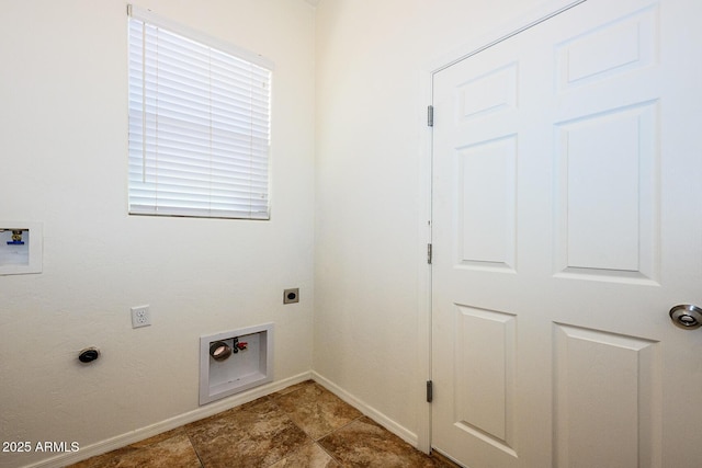 clothes washing area featuring baseboards, laundry area, hookup for an electric dryer, and hookup for a washing machine