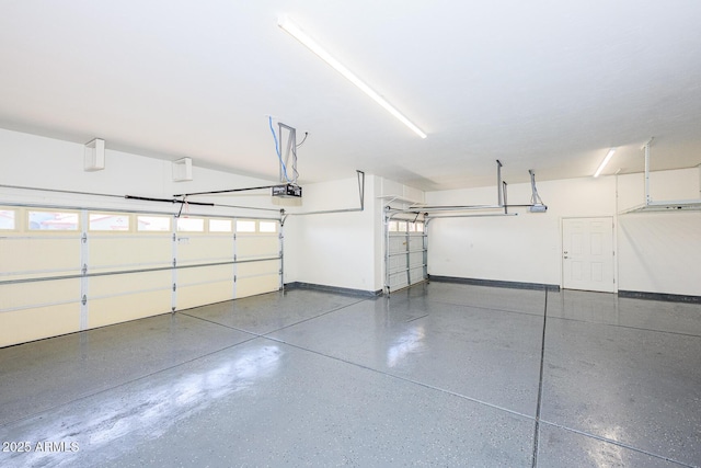 garage featuring baseboards and a garage door opener