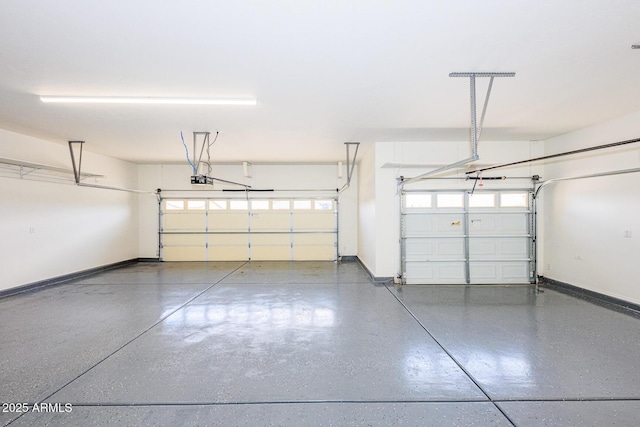 garage with baseboards and a garage door opener
