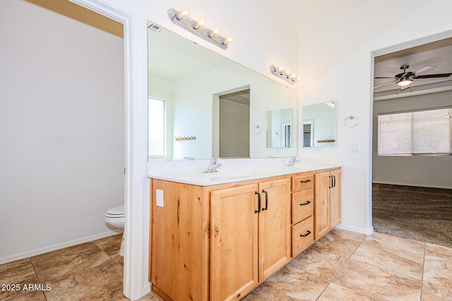 bathroom with a sink, a ceiling fan, and plenty of natural light