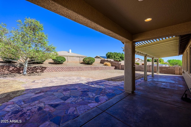 view of patio / terrace with a fenced backyard and a pergola