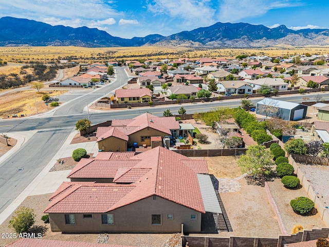 aerial view featuring a mountain view and a residential view