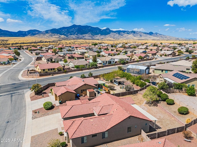 drone / aerial view featuring a residential view and a mountain view