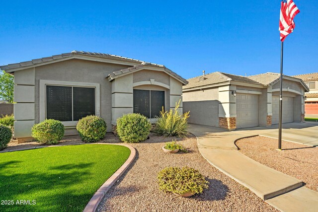 16396 W Fillmore St, Goodyear, AZ 85338 - ranch-style home with a garage, stucco siding, driveway, and a front lawn