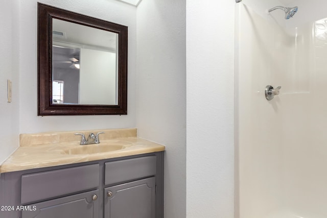 bathroom with vanity and walk in shower