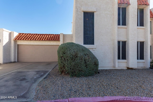 16053 N 26th Cir, Phoenix, AZ 85023 - view of front of house featuring stucco siding, a tiled roof, concrete driveway, and an attached garage