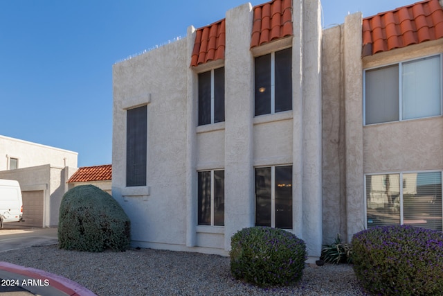 view of building exterior featuring a garage