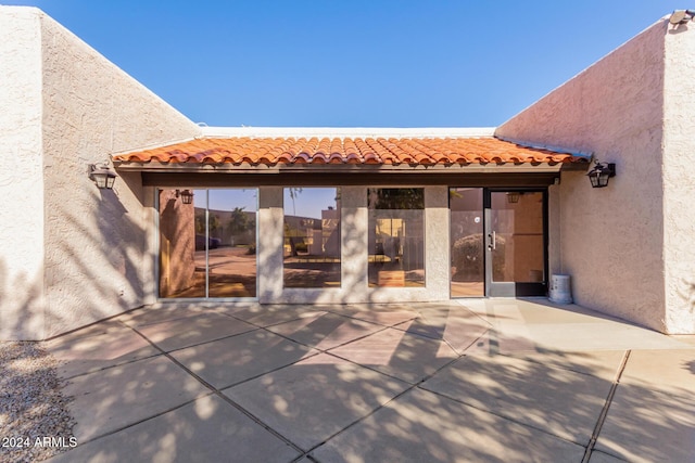 16053 N 26th Cir, Phoenix, AZ 85023 - rear view of house featuring a patio, stucco siding, and a tiled roof