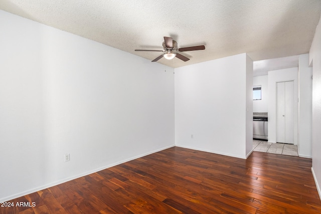 unfurnished room featuring a textured ceiling, ceiling fan, and light hardwood / wood-style flooring