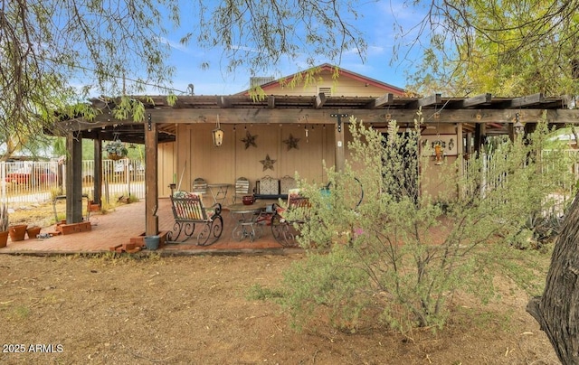 exterior space featuring a patio area and fence