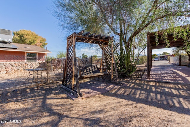 view of yard featuring central AC unit and fence