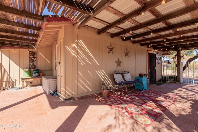 view of patio with fence and a gate