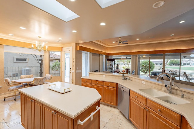 kitchen featuring a sink, stainless steel dishwasher, brown cabinetry, and light countertops