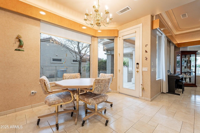 dining space with a notable chandelier, visible vents, plenty of natural light, and baseboards