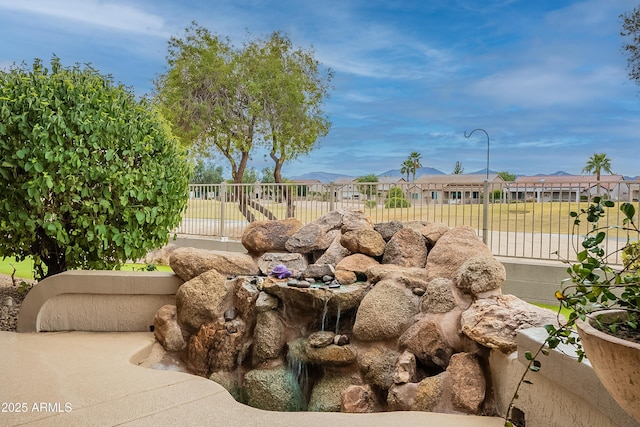 exterior space with fence and a residential view