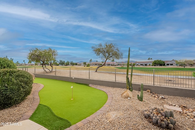 view of home's community with fence and a residential view