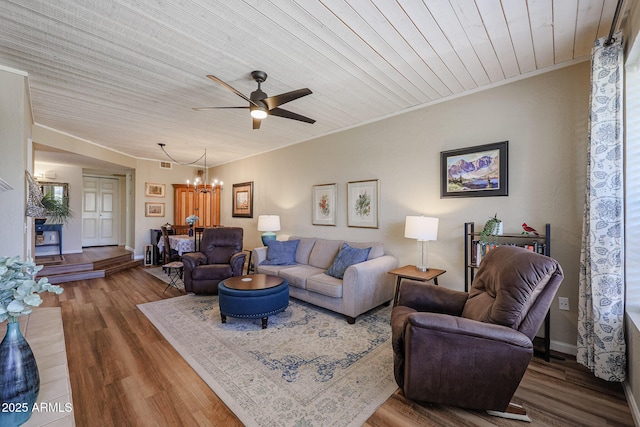 living room featuring ceiling fan with notable chandelier, wood-type flooring, and wood ceiling