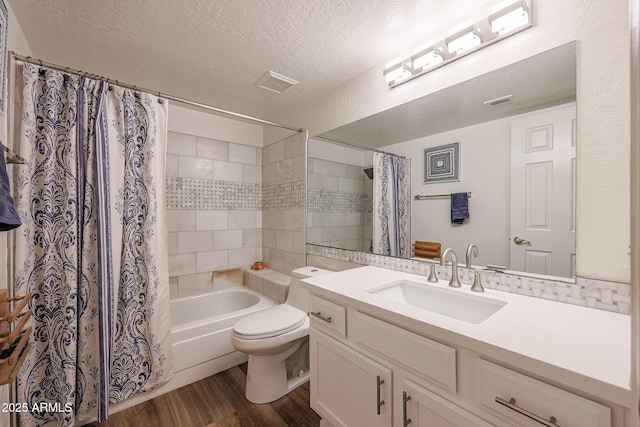 full bathroom with toilet, a textured ceiling, wood-type flooring, shower / bath combo, and vanity